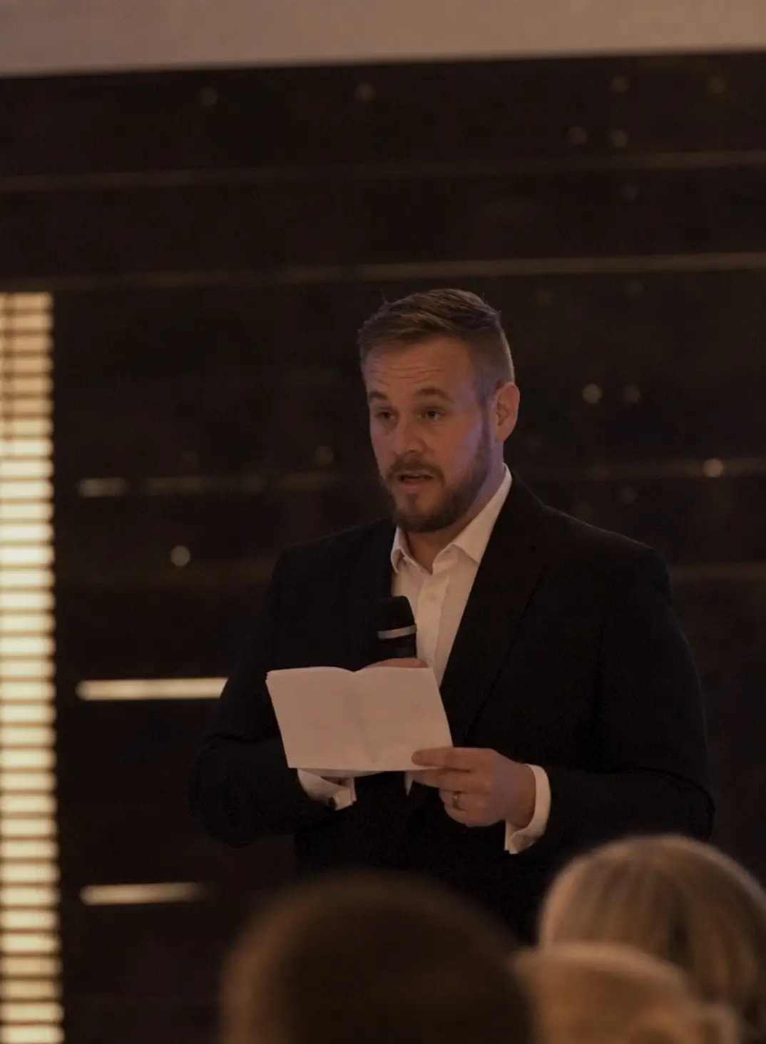 Des speaking at a conference